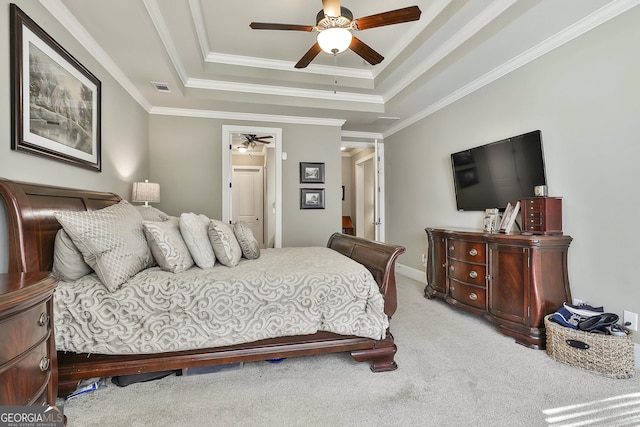 bedroom featuring visible vents, carpet floors, ceiling fan, crown molding, and a raised ceiling