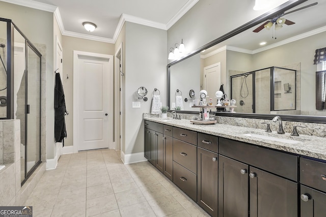 bathroom with ceiling fan, ornamental molding, a stall shower, and a sink