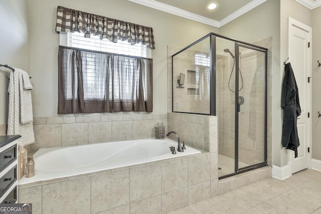 bathroom with a stall shower, ornamental molding, and a bath