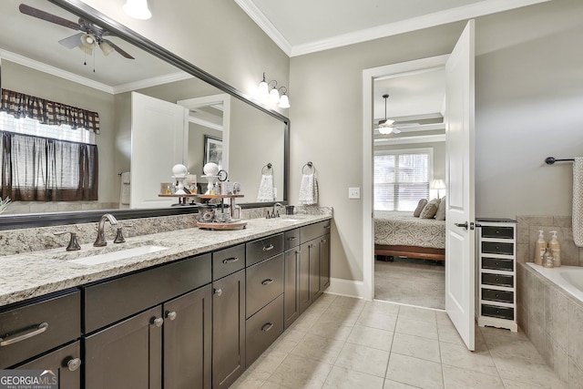 ensuite bathroom with a sink, crown molding, tile patterned floors, and ceiling fan