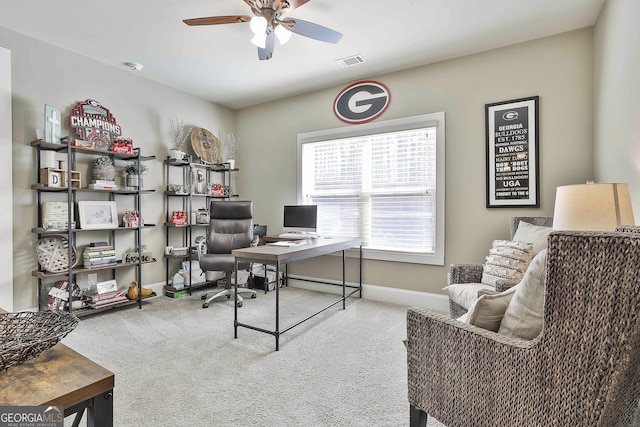 office with visible vents, baseboards, carpet, and ceiling fan