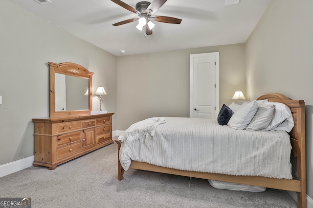 bedroom with baseboards, light carpet, and a ceiling fan