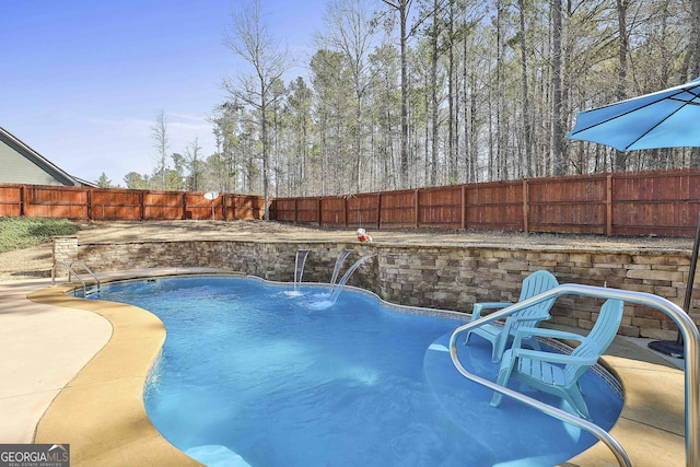 view of swimming pool with a patio area, a fenced backyard, and a fenced in pool