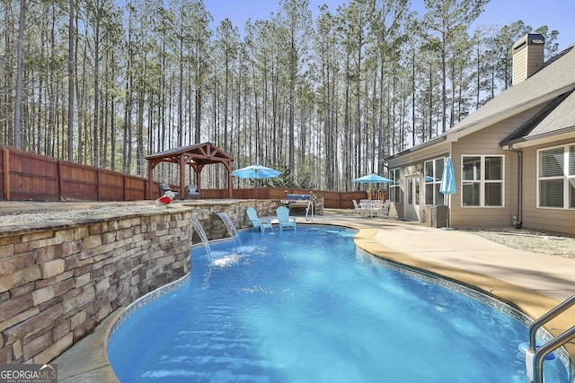 view of pool with a fenced in pool, a patio, and a fenced backyard