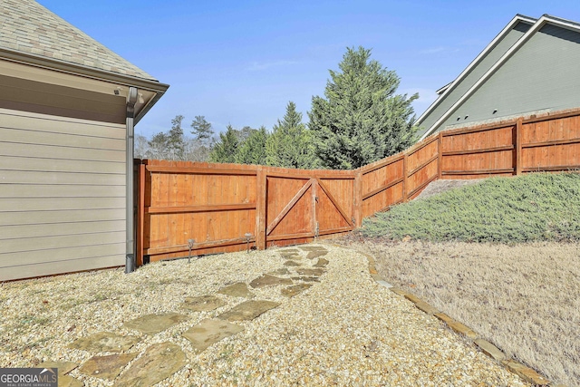 view of gate featuring fence