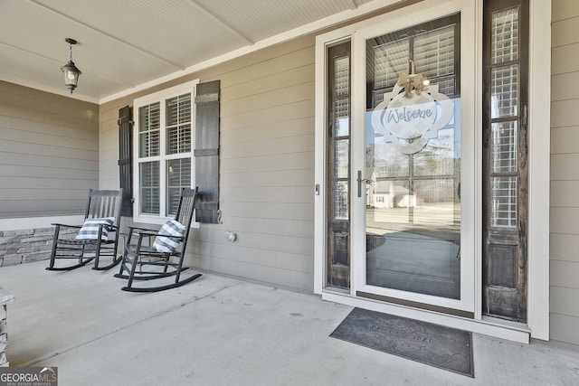 property entrance featuring covered porch