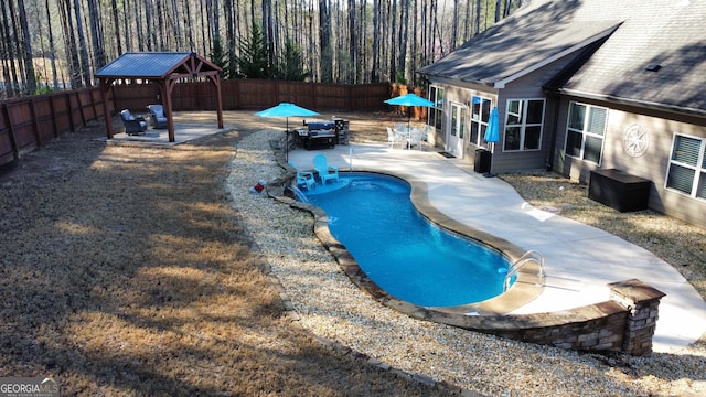 view of swimming pool featuring a gazebo, a fenced in pool, a patio, and a fenced backyard