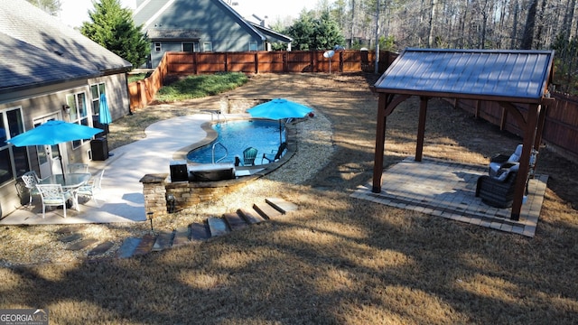 exterior space with a patio, a fenced backyard, and a fenced in pool