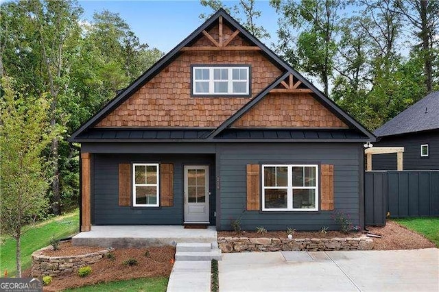 craftsman inspired home with metal roof and a standing seam roof