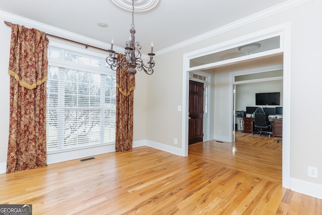unfurnished dining area featuring an inviting chandelier, visible vents, light wood-type flooring, and ornamental molding