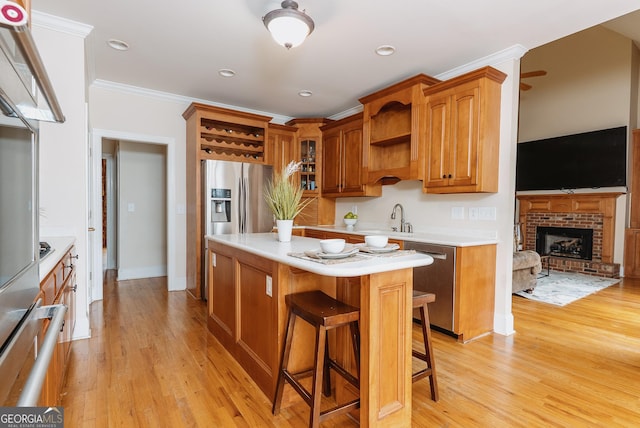 kitchen with open shelves, appliances with stainless steel finishes, crown molding, and light wood finished floors