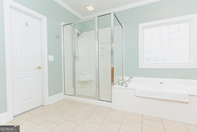 bathroom with tile patterned flooring, crown molding, a bath, and a stall shower