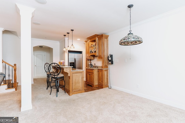 kitchen with arched walkways, light colored carpet, a breakfast bar, and stainless steel refrigerator with ice dispenser