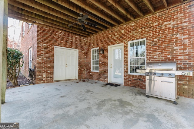 view of side of home featuring stairway, a yard, a wooden deck, brick siding, and a chimney