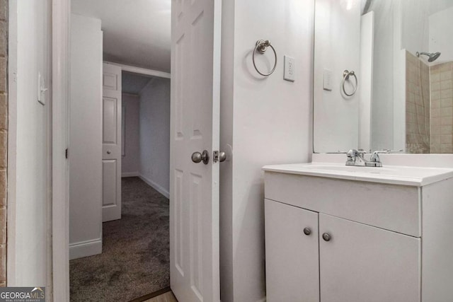 bathroom with vanity and baseboards