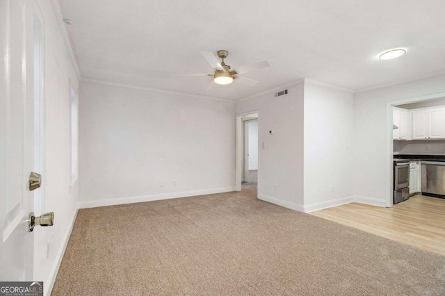 unfurnished living room with light carpet, ceiling fan, and ornamental molding