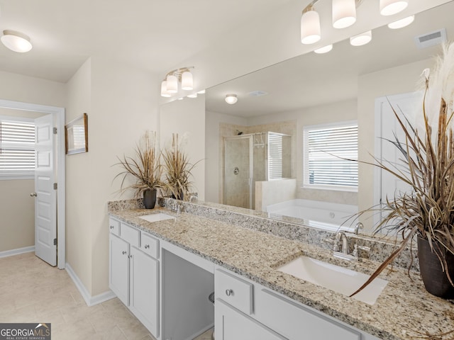 full bath featuring a sink, visible vents, a garden tub, and a stall shower