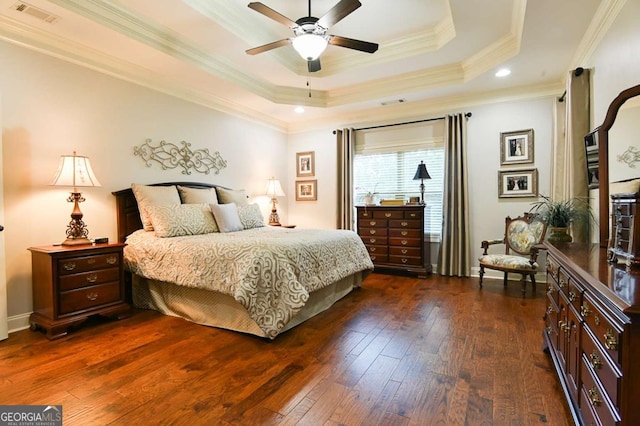 bedroom with a ceiling fan, dark wood-style floors, visible vents, crown molding, and a raised ceiling