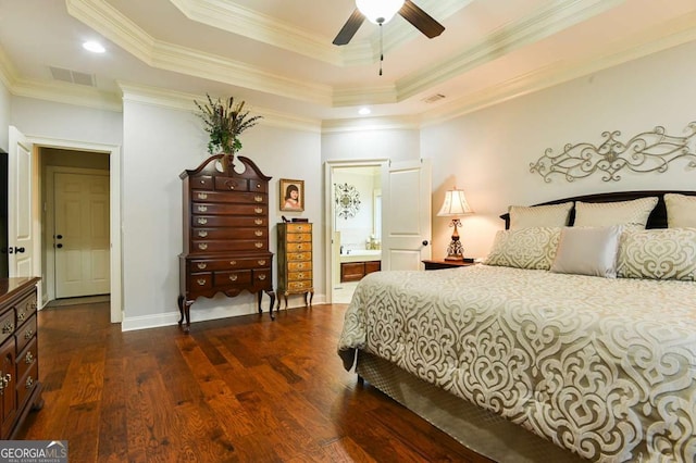 bedroom with visible vents, ornamental molding, baseboards, a raised ceiling, and dark wood-style flooring