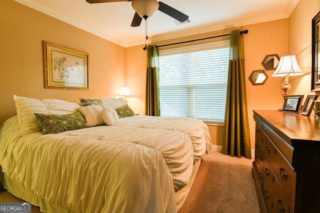 bedroom featuring a ceiling fan, crown molding, carpet, and baseboards