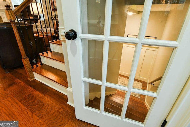 stairway with wood finished floors