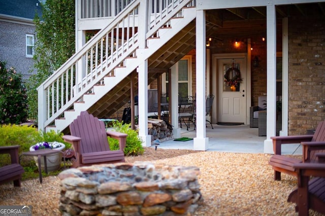 view of exterior entry featuring brick siding