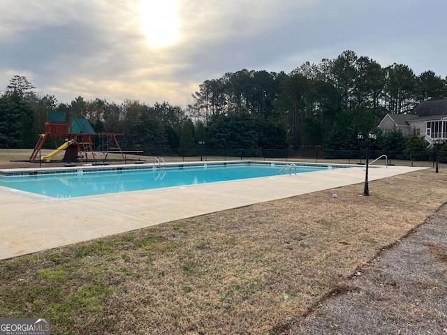 pool featuring fence and playground community