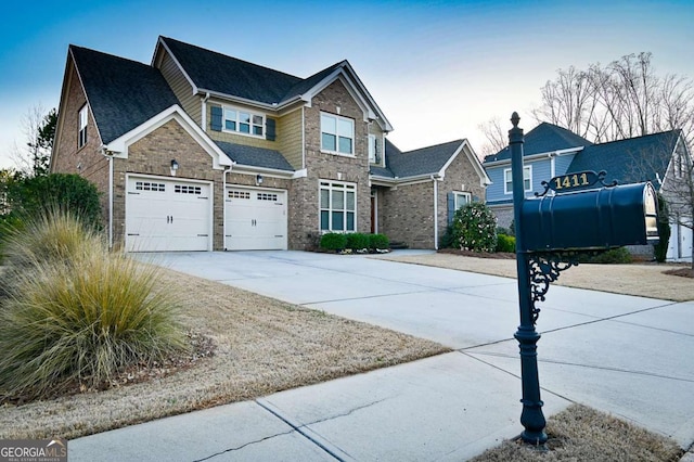 view of front facade featuring brick siding, driveway, an attached garage, and roof with shingles