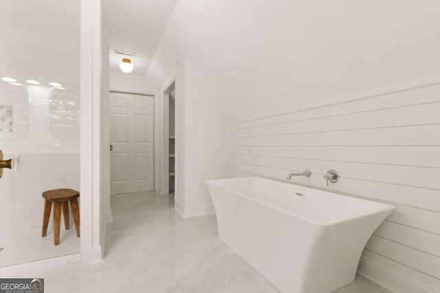 full bath with visible vents and a freestanding bath