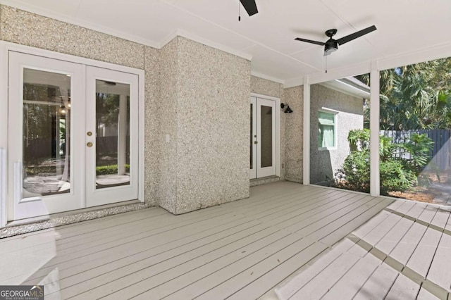 deck with french doors, ceiling fan, and fence