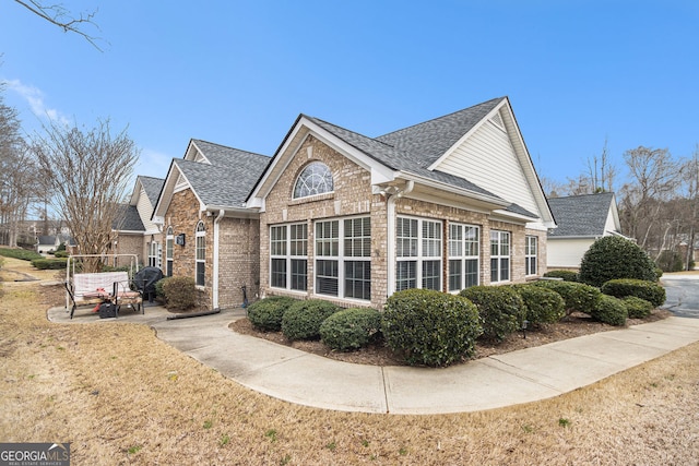 4809 Shae Ct Unit 5, Powder Springs, GA 30127 - view of side of property with brick siding, a yard, and a shingled roof