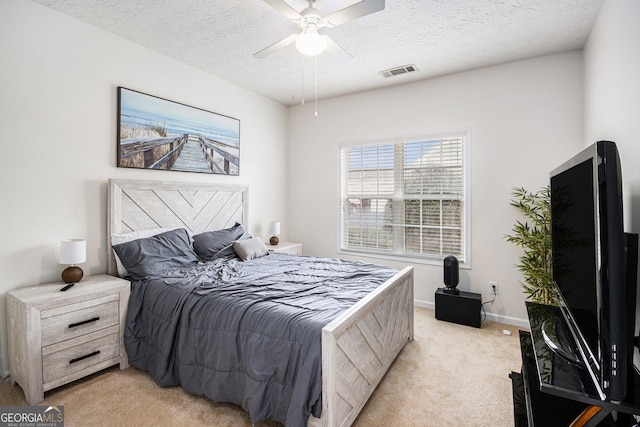 4809 Shae Ct Unit 5, Powder Springs, GA 30127 - bedroom featuring a textured ceiling, baseboards, visible vents, light colored carpet, and ceiling fan