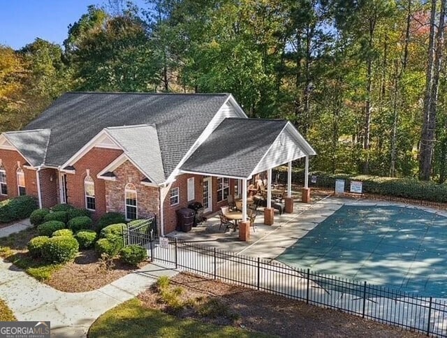 4809 Shae Ct Unit 5, Powder Springs, GA 30127 - exterior space with brick siding, a patio area, a fenced in pool, and fence