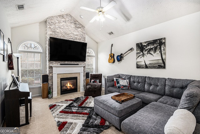 4809 Shae Ct Unit 5, Powder Springs, GA 30127 - living area with a textured ceiling, visible vents, a ceiling fan, a large fireplace, and carpet floors