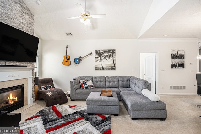 4809 Shae Ct Unit 5, Powder Springs, GA 30127 - carpeted living area featuring a fireplace, lofted ceiling, visible vents, and ceiling fan