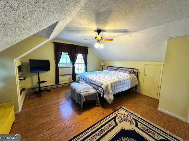 bedroom with a ceiling fan, a textured ceiling, wood finished floors, lofted ceiling, and baseboard heating