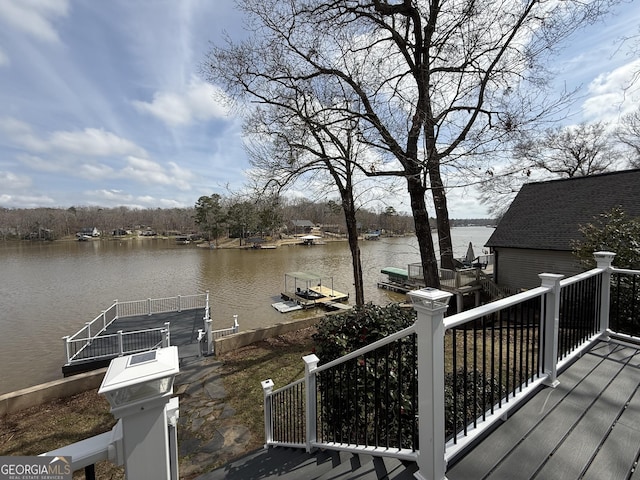 wooden terrace featuring a dock and a water view