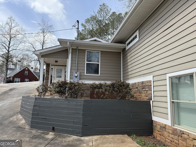 exterior space with fence and driveway