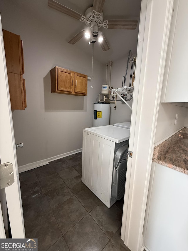 laundry area with a ceiling fan, baseboards, washer / clothes dryer, electric water heater, and dark tile patterned floors