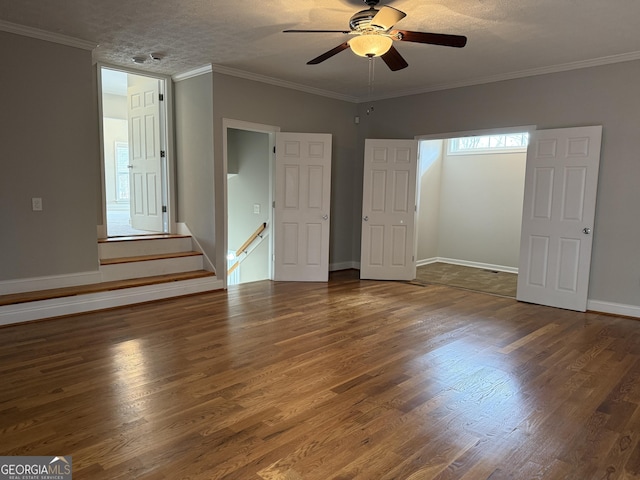 interior space featuring ceiling fan, wood finished floors, and crown molding