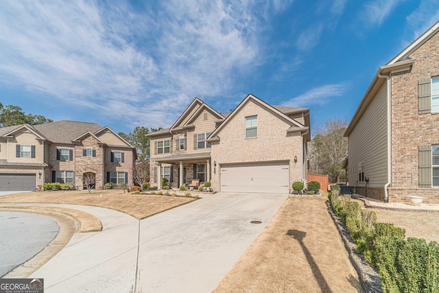 view of front of house with concrete driveway, an attached garage, and brick siding