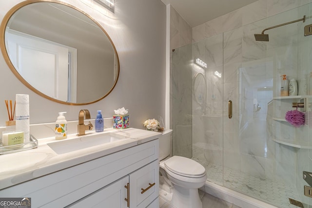 bathroom with a stall shower, toilet, and vanity