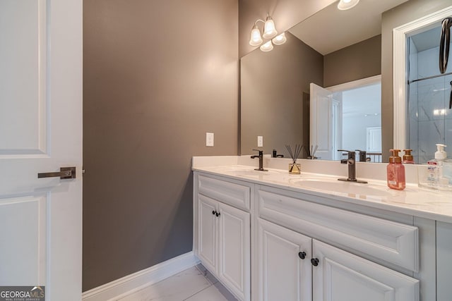 full bathroom featuring a sink, baseboards, marble finish floor, and double vanity