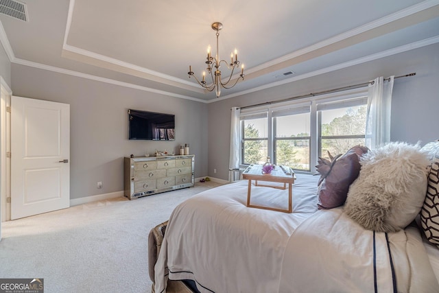 bedroom with visible vents, a raised ceiling, and a notable chandelier