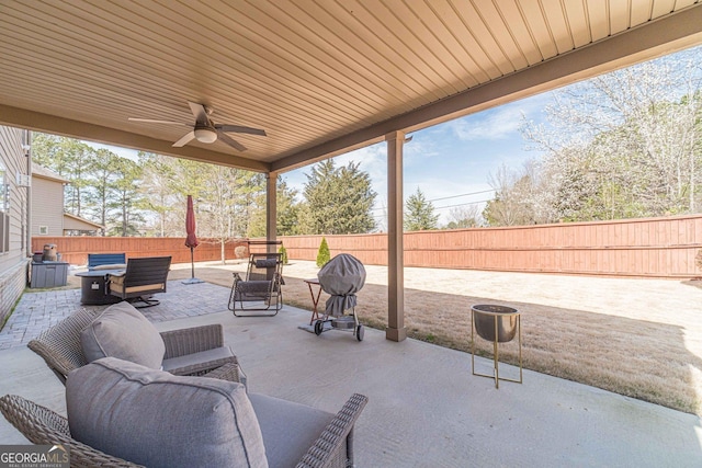 view of patio featuring a ceiling fan and a fenced backyard