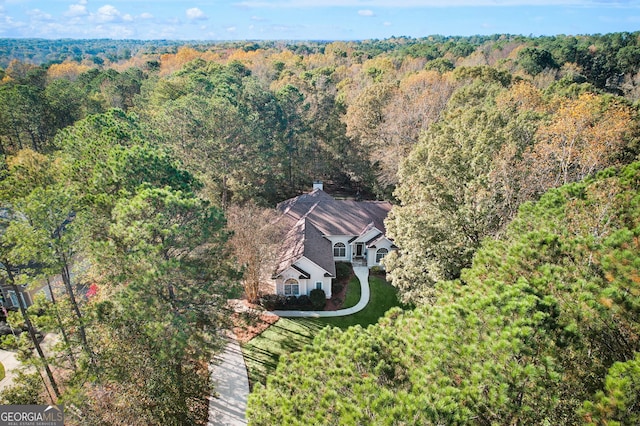 aerial view featuring a view of trees