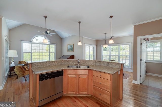 kitchen featuring dishwasher, light wood-type flooring, a ceiling fan, and a sink