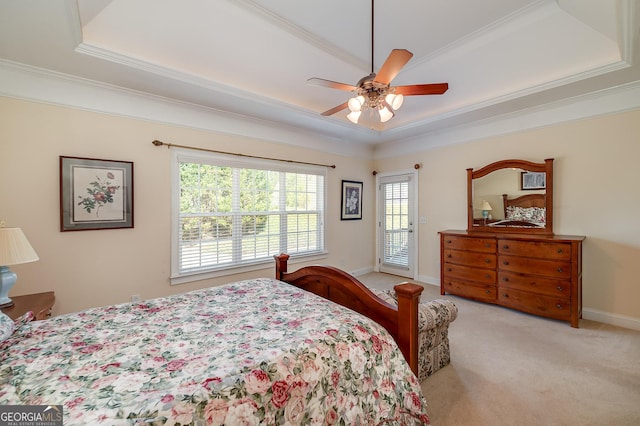 bedroom with a raised ceiling, crown molding, carpet flooring, and access to outside