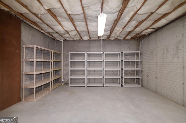 unfinished basement with brick wall