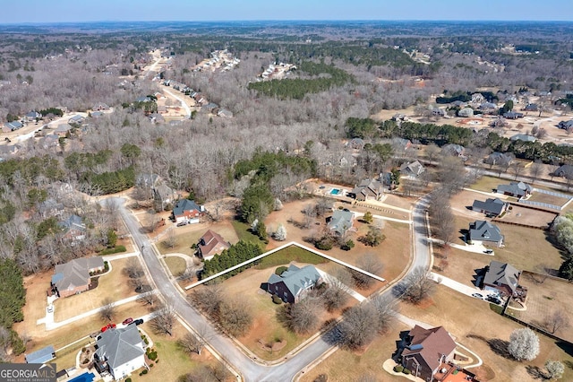 bird's eye view featuring a forest view